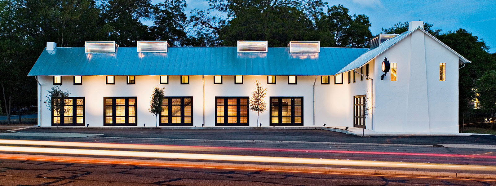 Exterior shot of John Grable Architects office building at night